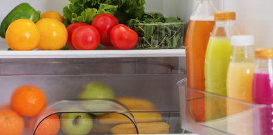juices, vegetables, and fruit inside a refrigerator 