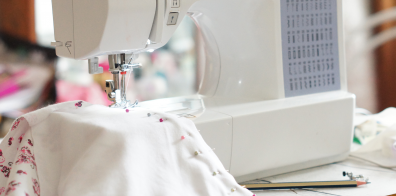 fabric being sewed via a sewing machine