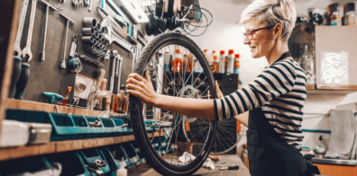 Women fixing a bicycle 