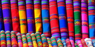 Rolls of colourful patterned fabrics