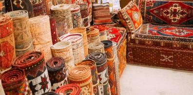 Rolls of colourful rugs